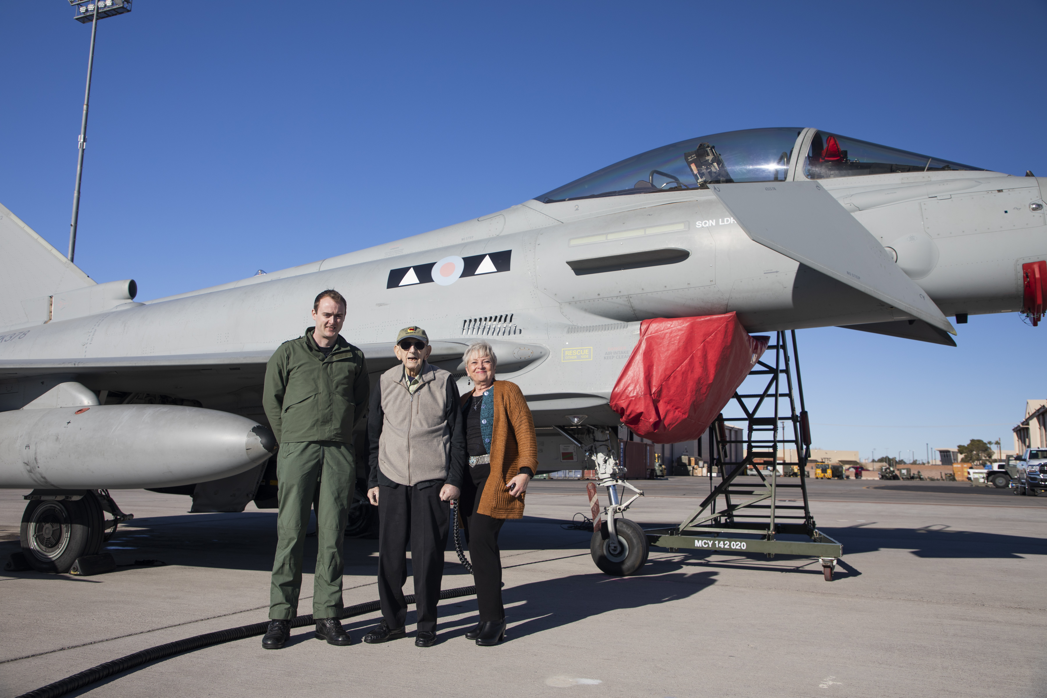 Image shows RAF Veteran with personnel and Typhoon aircraft on the airfield.