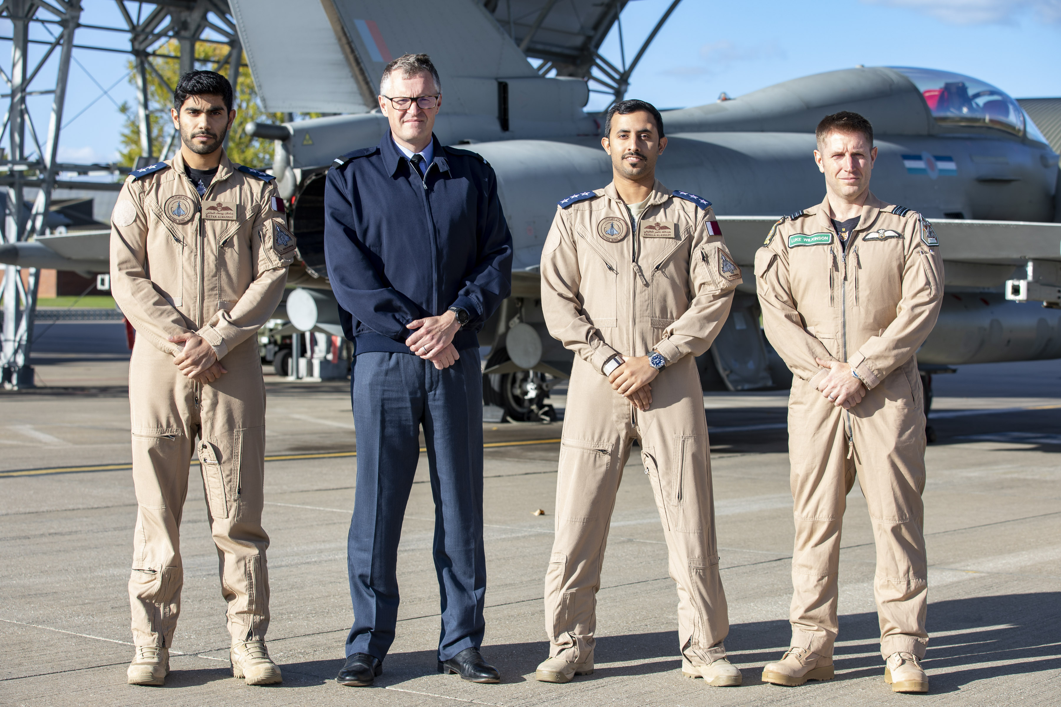 Image shows RAF Pilots standing on airfield with Typhoons.