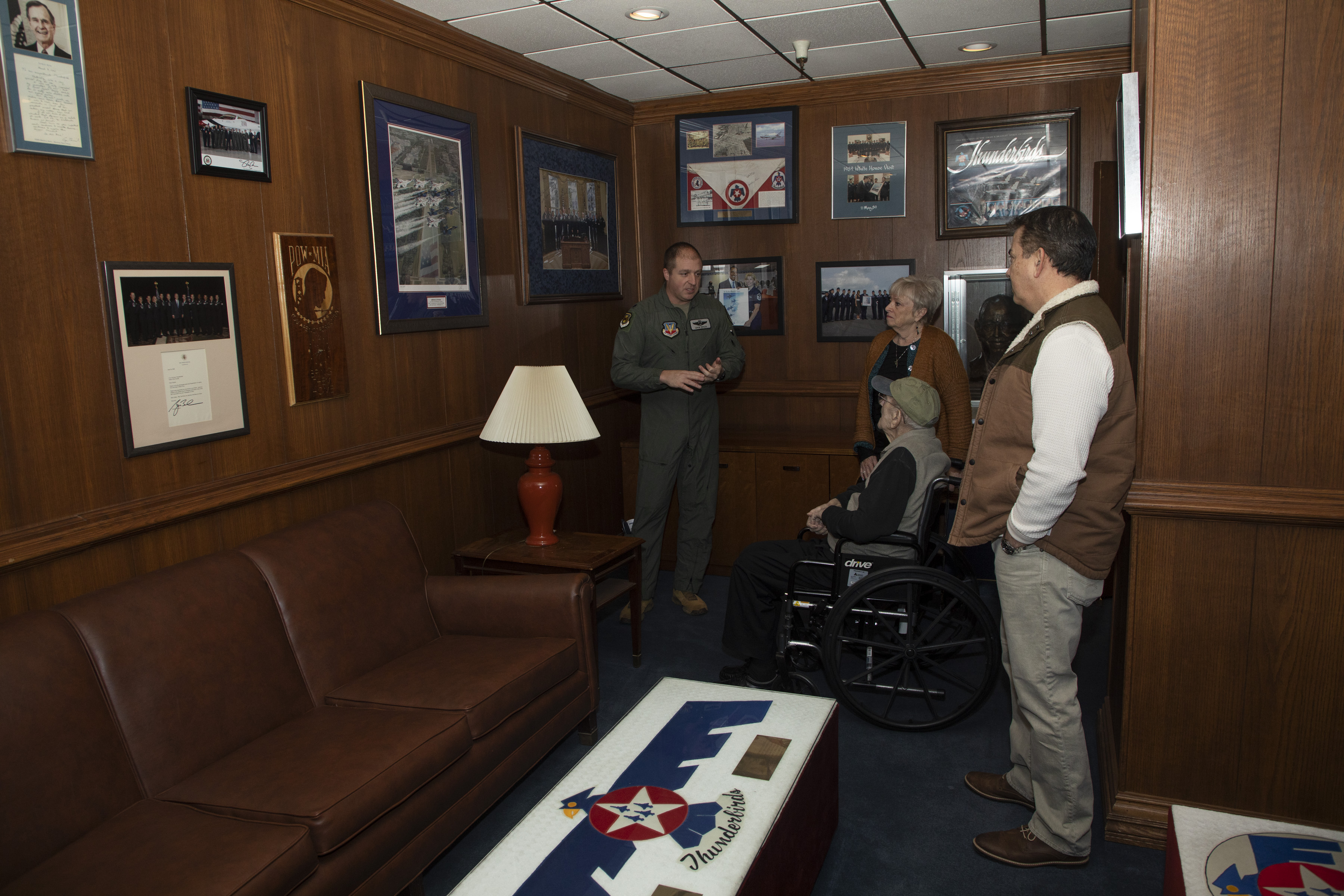 Image shows room with pictures and RAF Veteran, United States Air Force personnel and civilians.