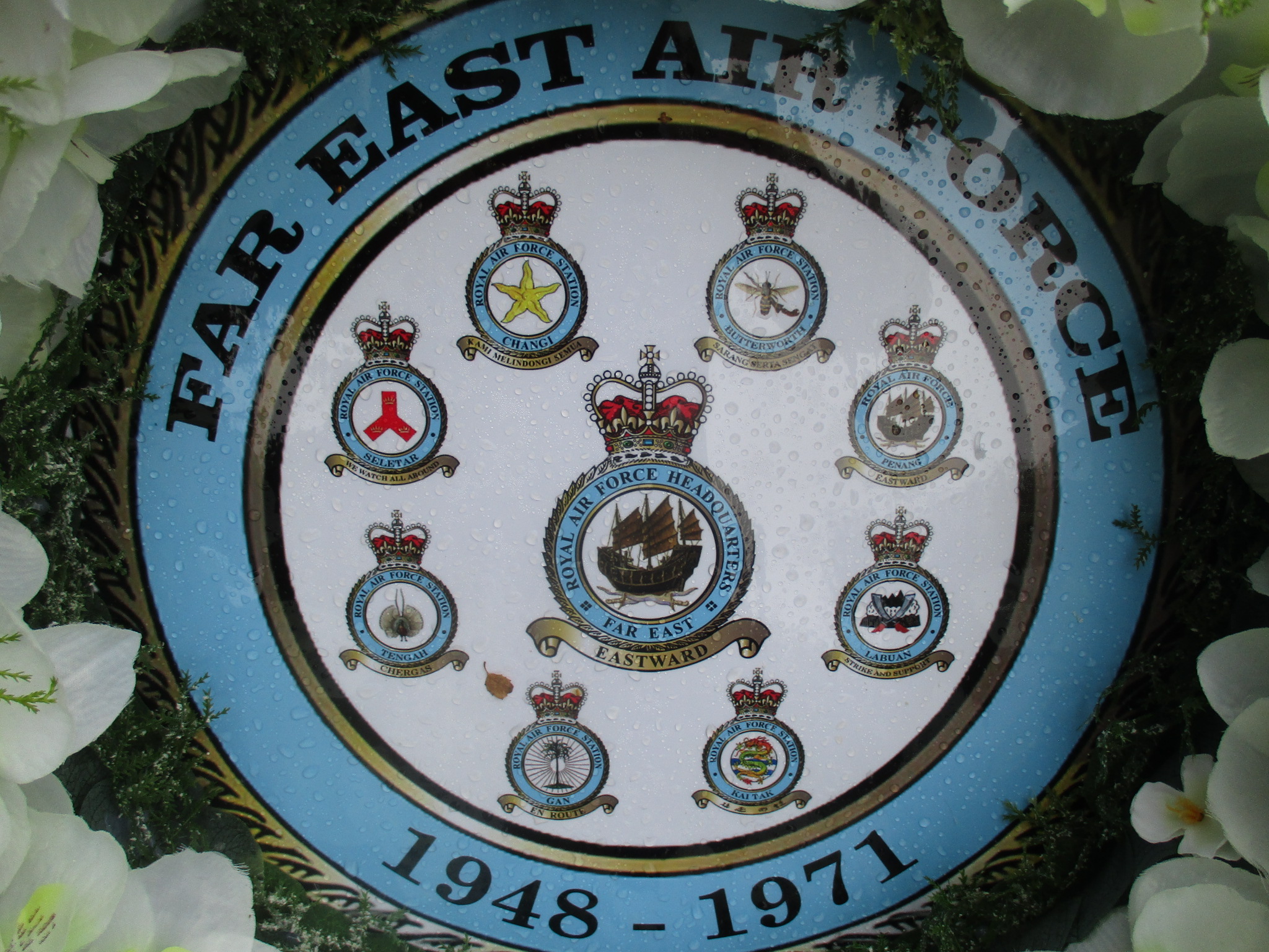 Wreath with Squadron crests and flowers.