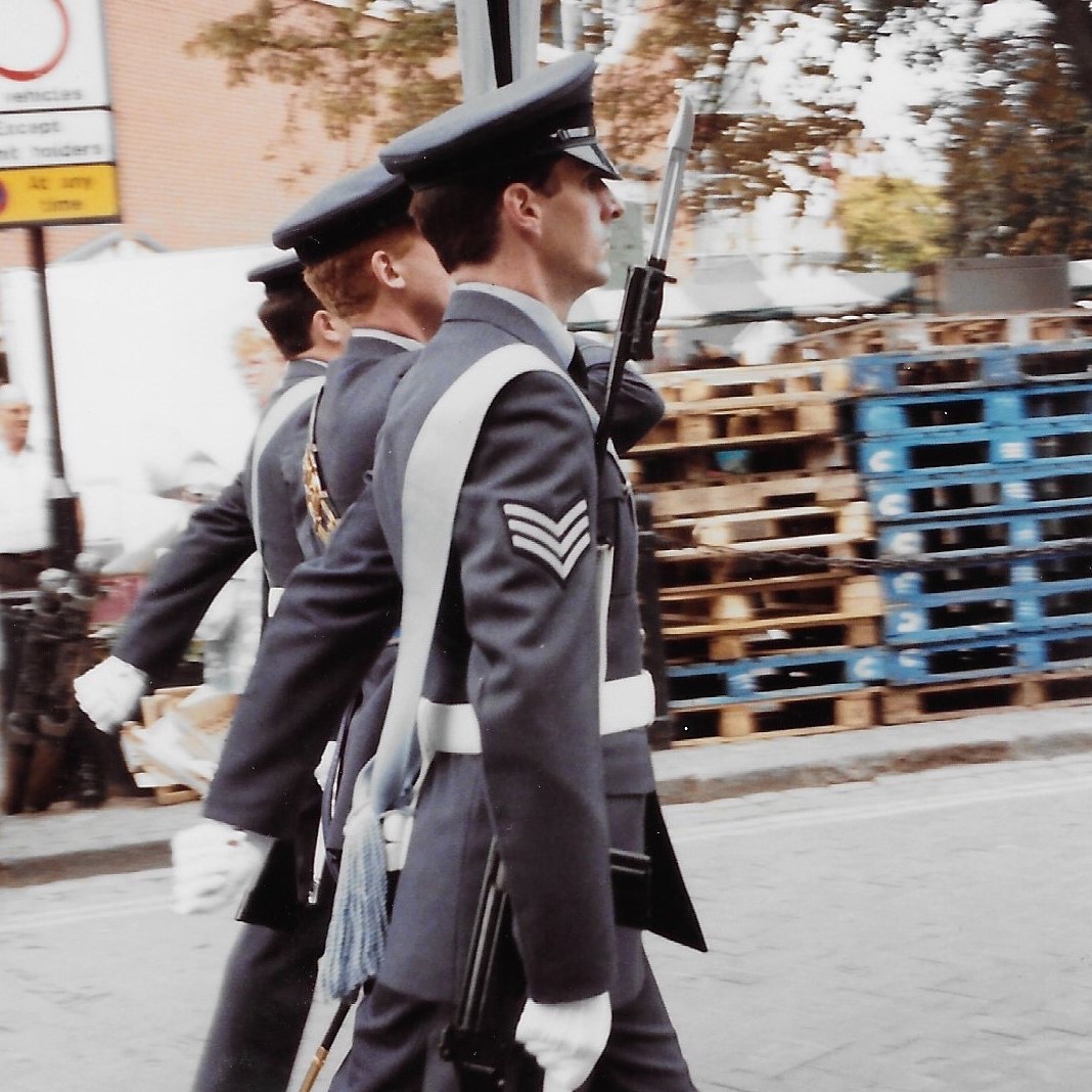 Archived image shows Image shows RAF Aviators parading through street.