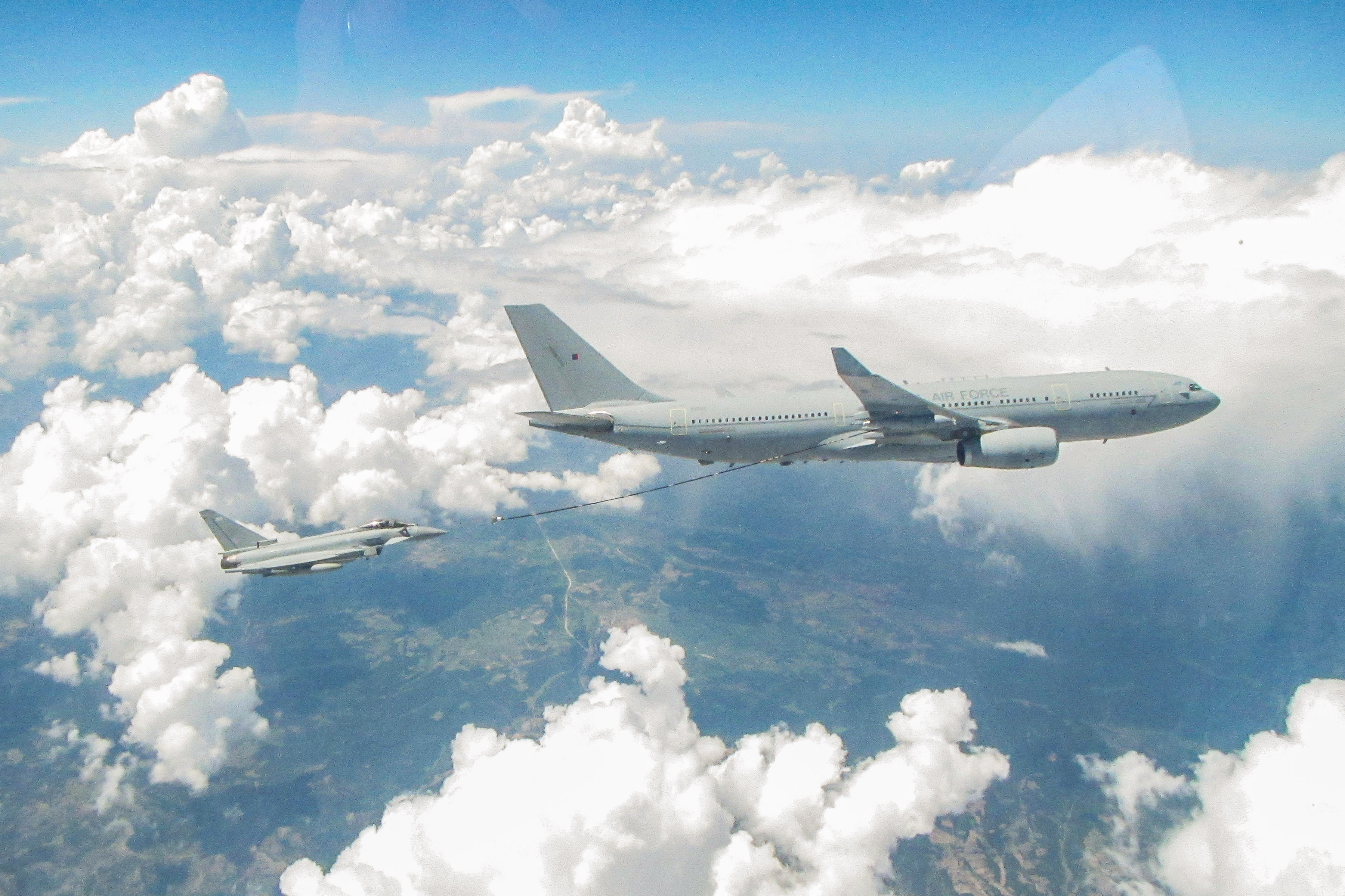 Image shows Typhoon in air to air refuelling of Voyager aircraft.