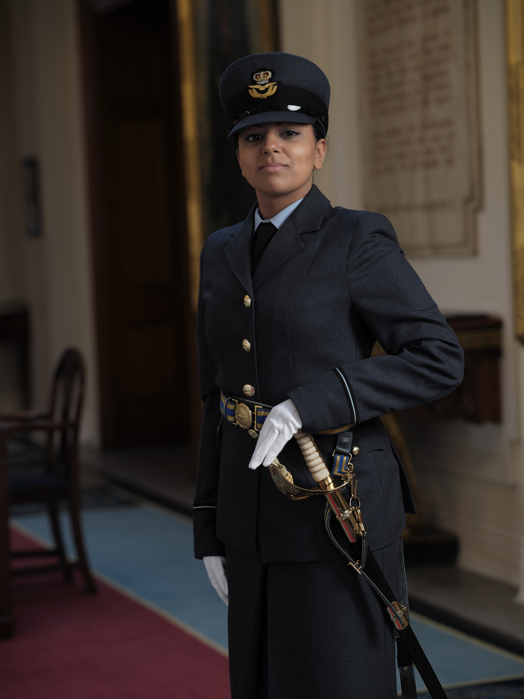 Image shows RAF aviator in uniform for official portrait.