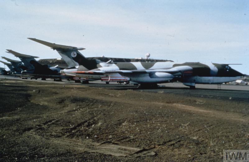 Aged image of Vulcan bombers on airfield.