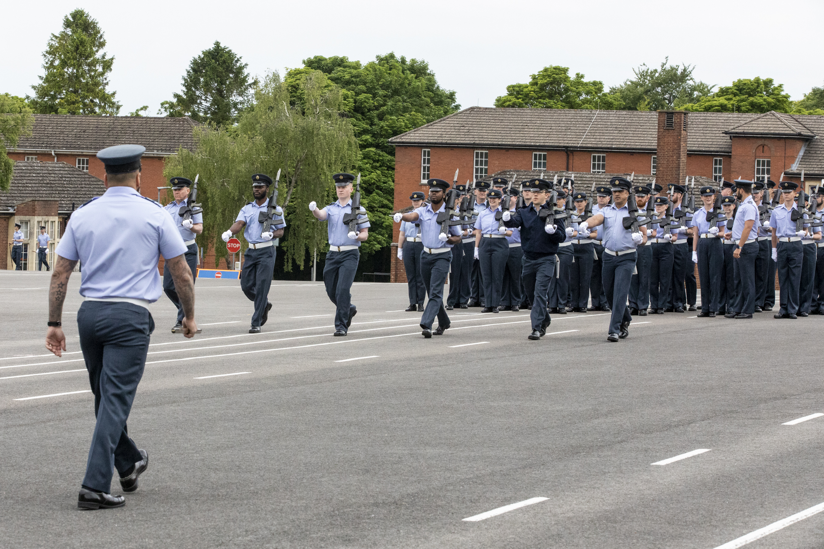 Aviators practise on parade, with rifles.
