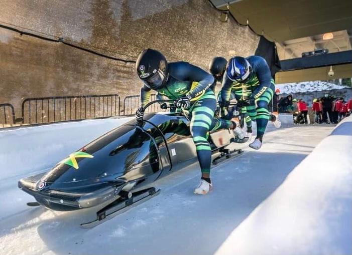 Competitors starting a Bobsleigh run.