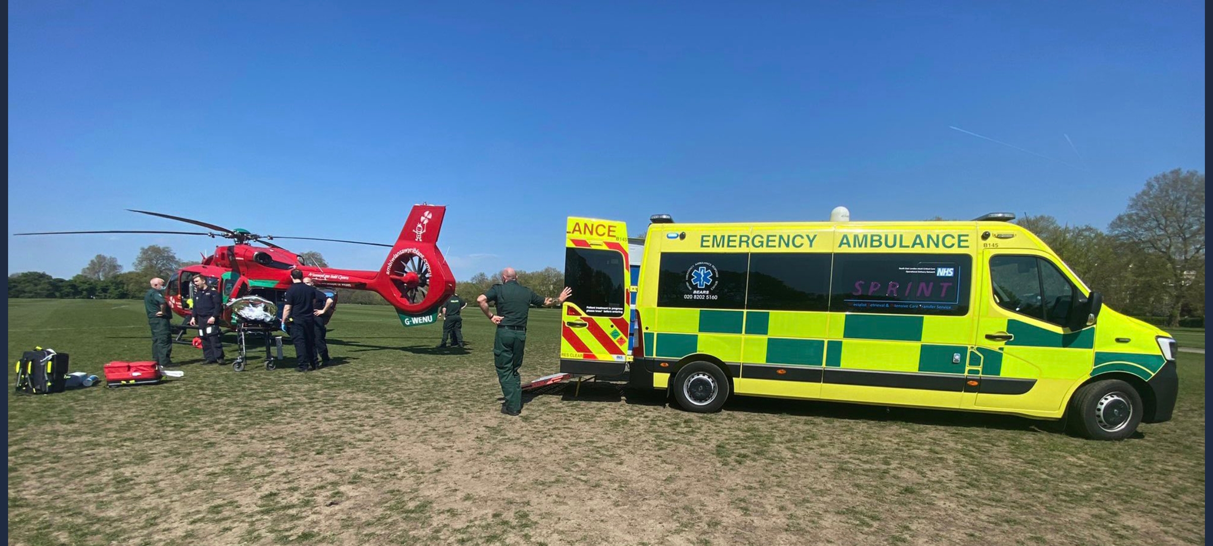 Image shows RAF medics with an air ambulance helicopter and van.