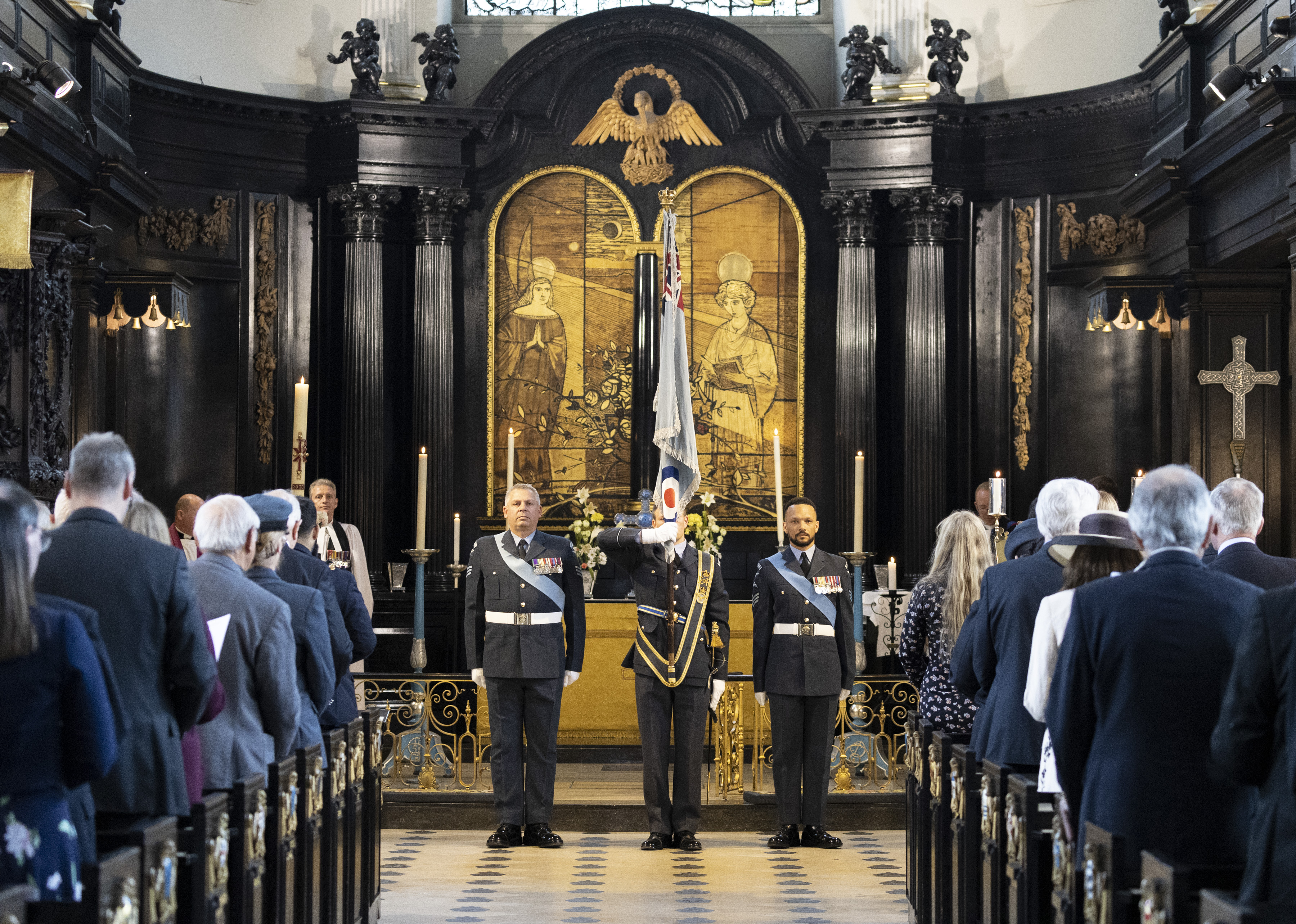 Image shows RAF Ceremonial squadron bearing the RAF colour inside St Clements Danes Church.