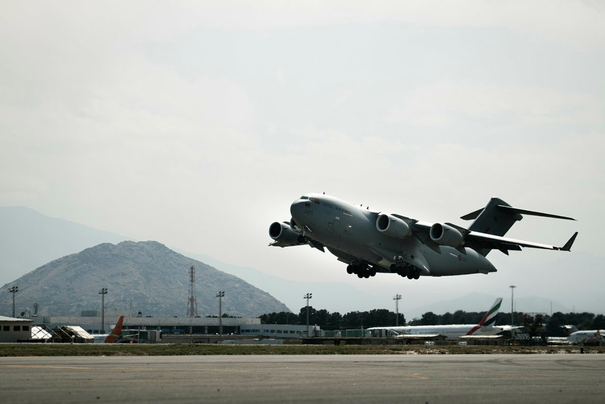 Globemaster taking off from airfield.
