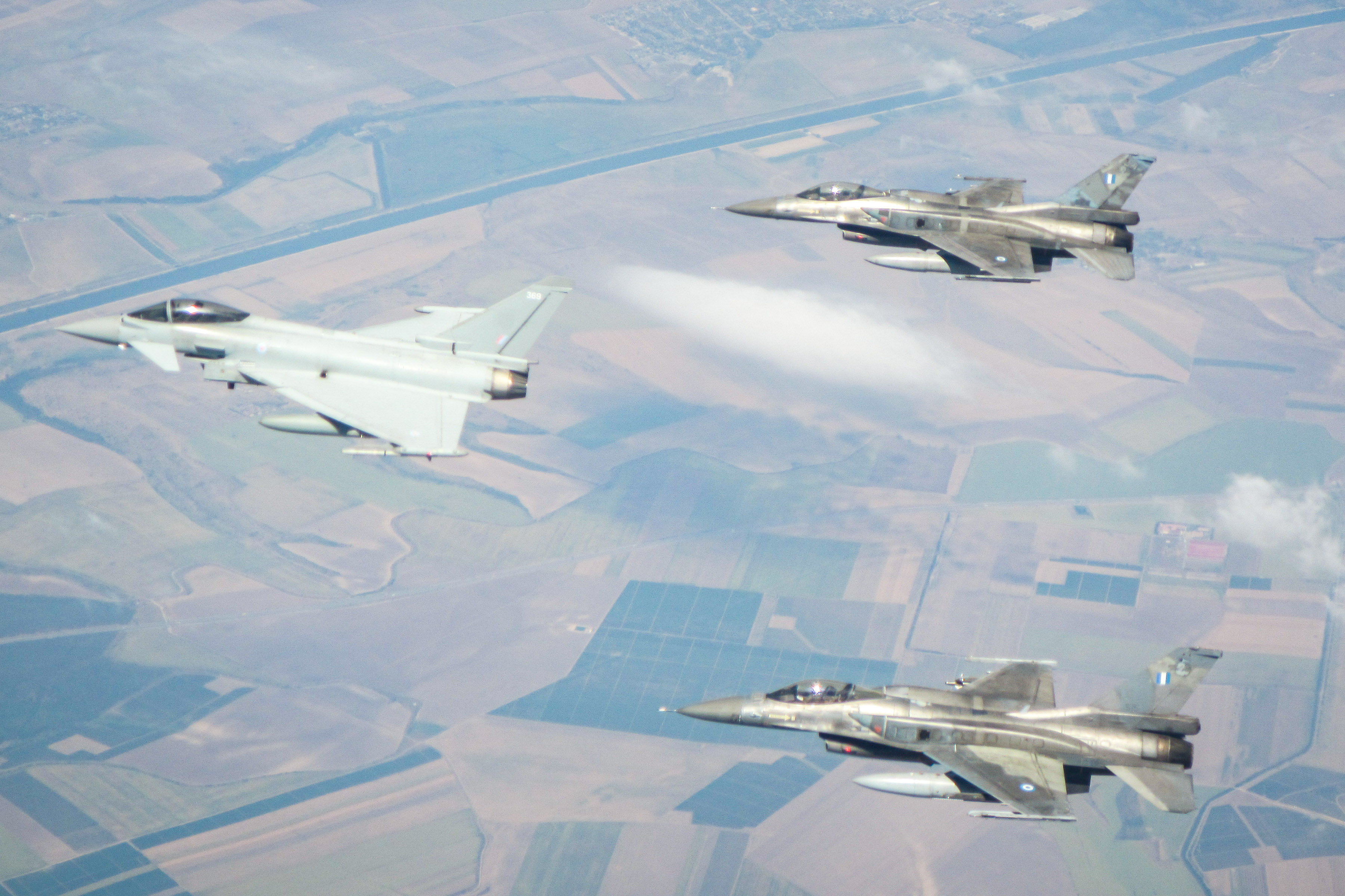Image shows Typhoon aircraft in flight with two F-16's