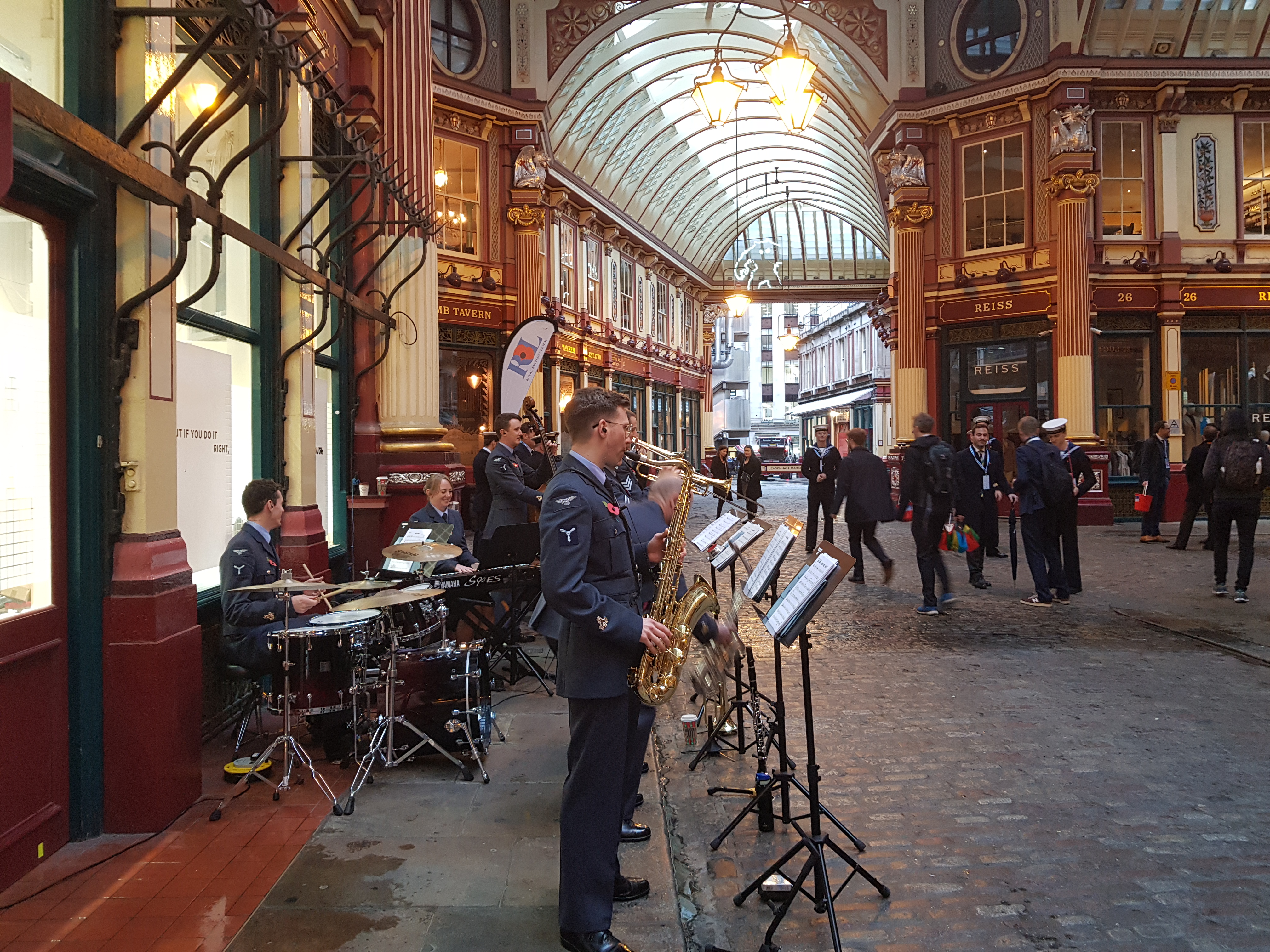 Image shows RAF Musicians performing in a shopping centre.