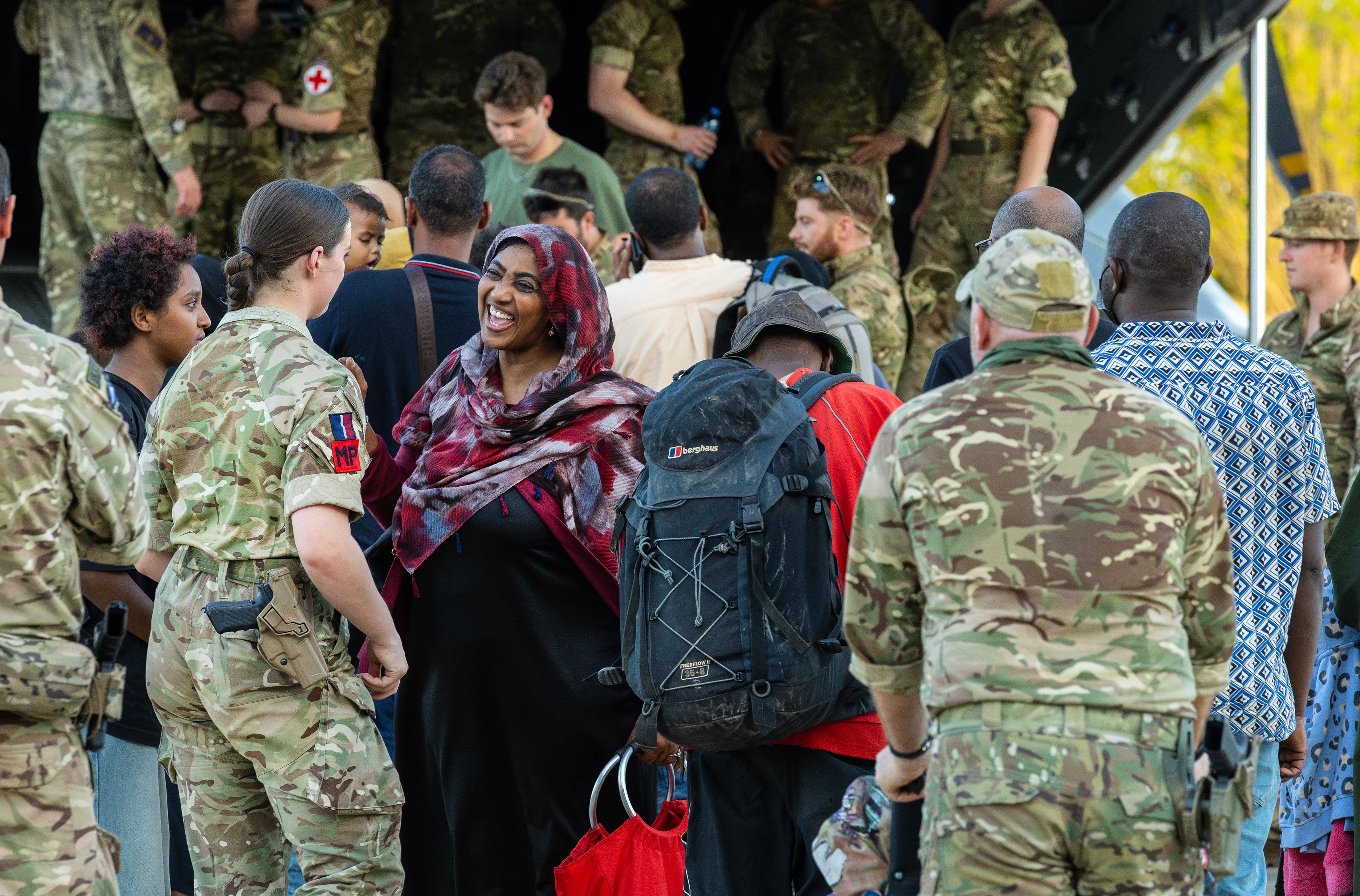 RAF Personnel assisting refugees onto the aircraft