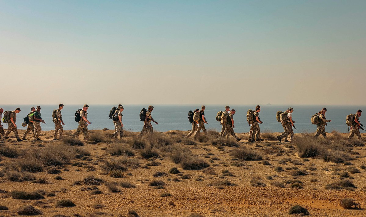 Personnel in Cyprus marching along the coastline