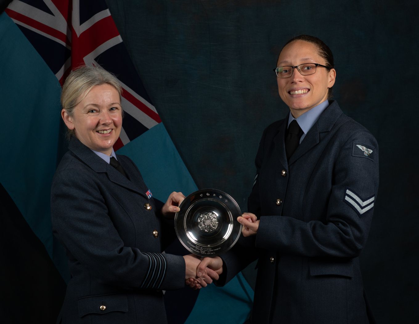 Cpl Impey in RAF uniform accepting an award