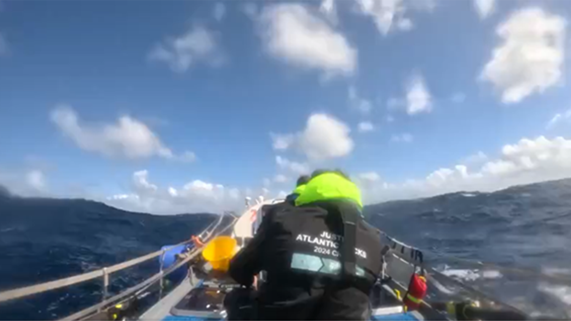 First person photo taken from in the boat of the crew rowing.