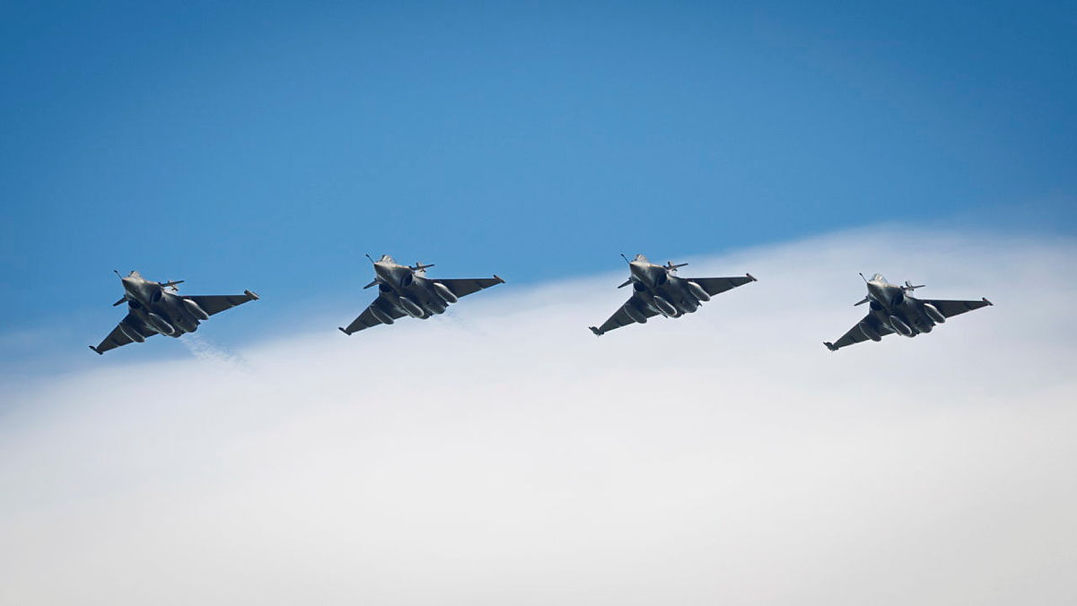 4 fast jets flying in formation, ready to refuel.