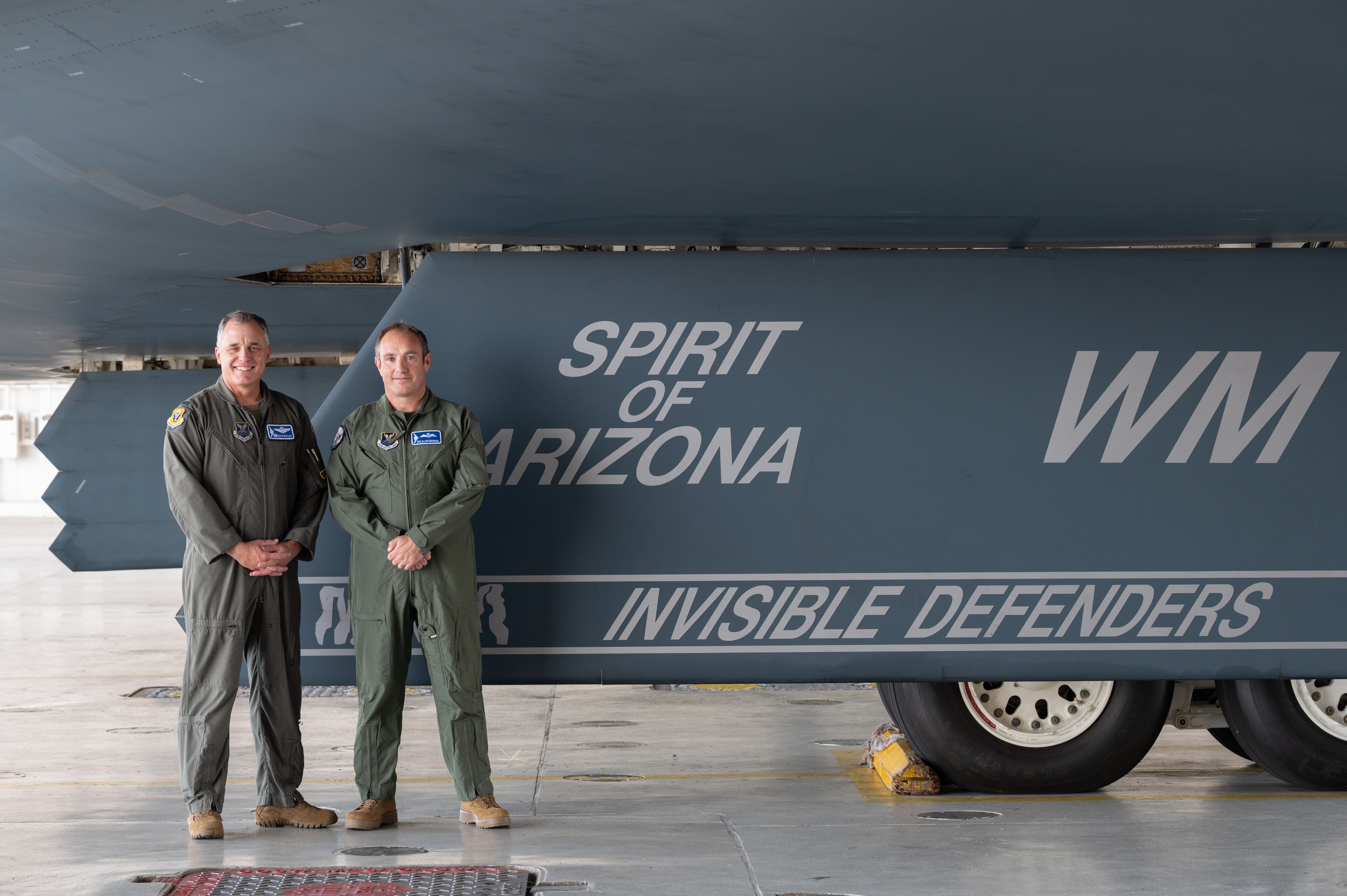 Butler (left) and Marshall (right) in front of B-2 bomber
