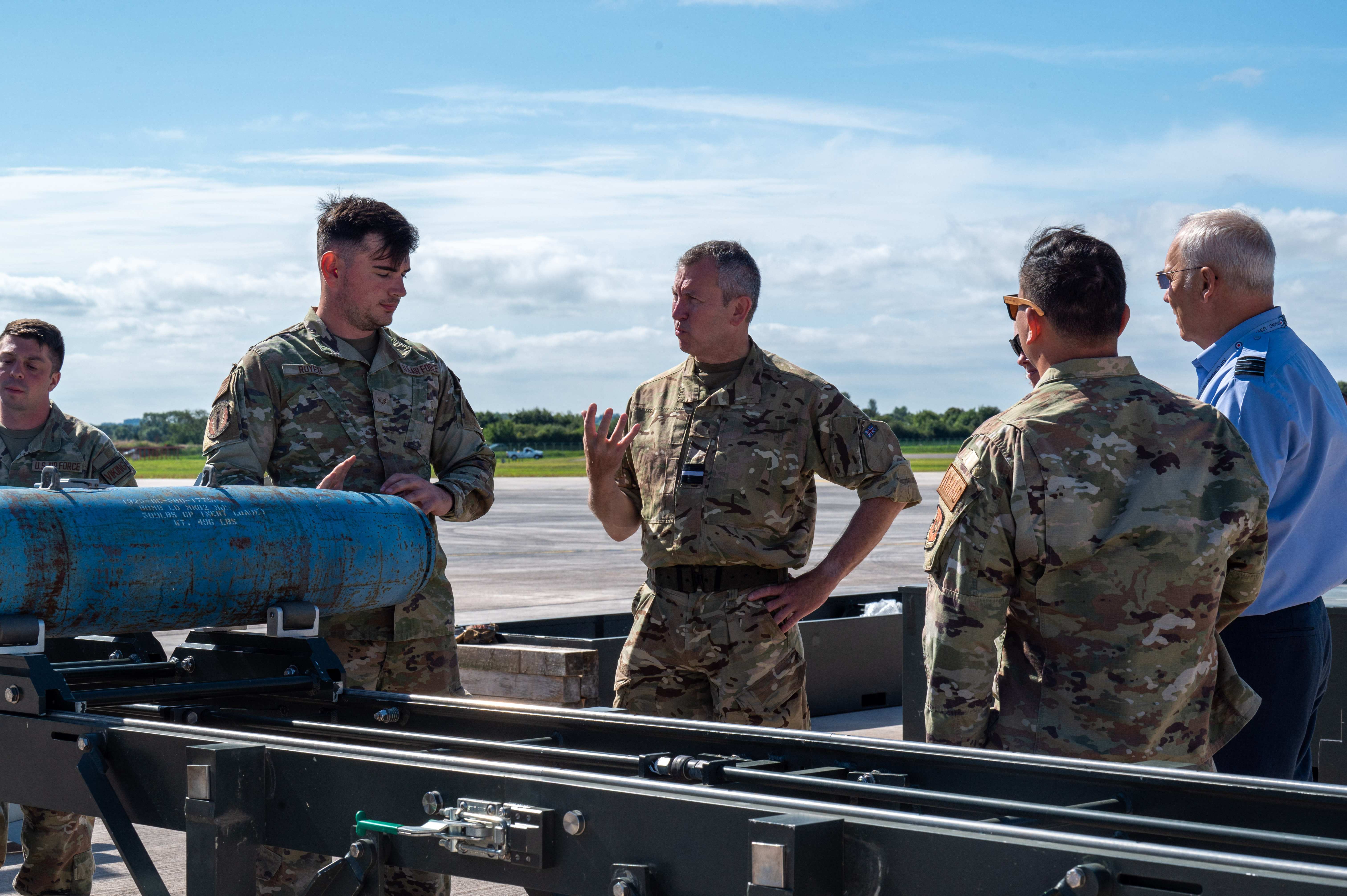 RAF and USAF personnel working together with the bombs