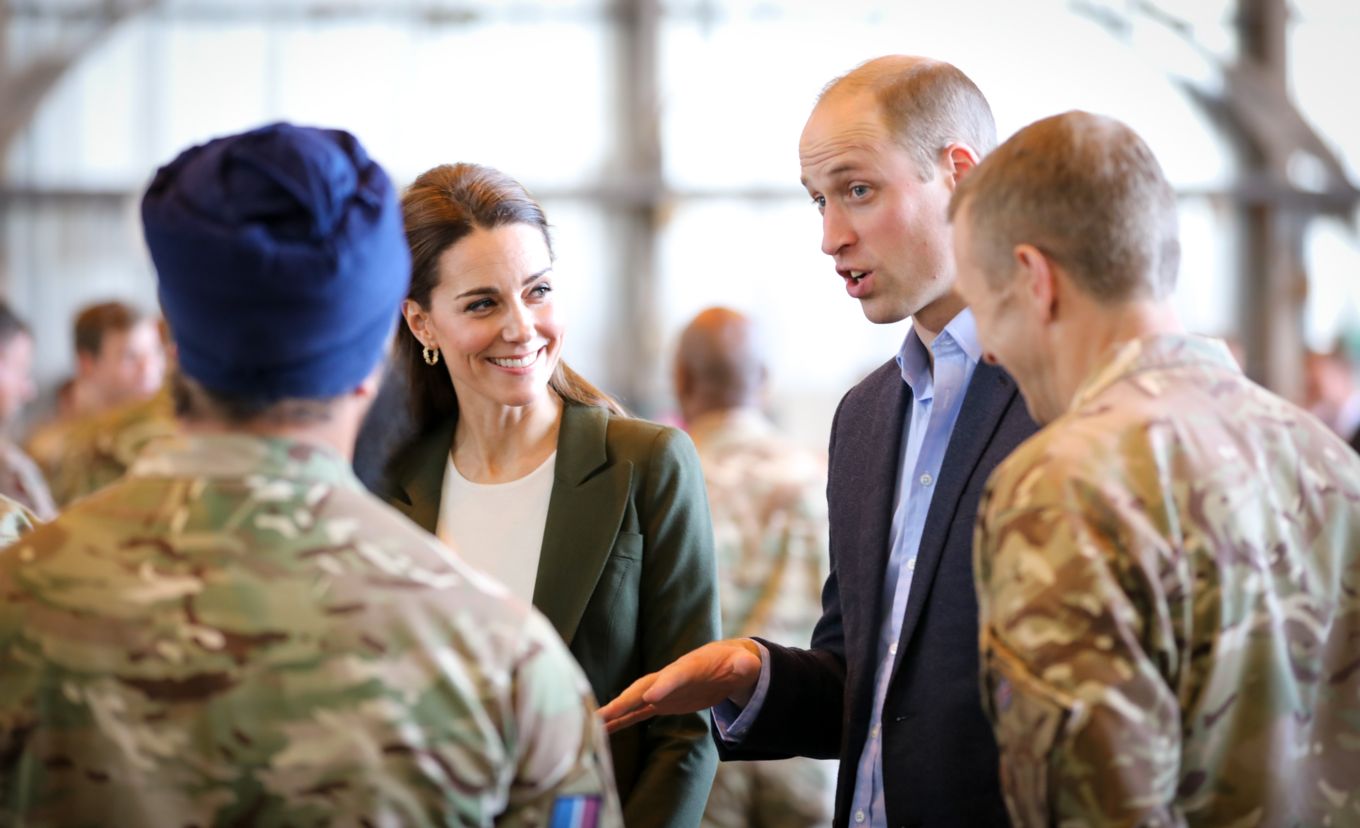 royal-couple-speaking-to-personnel