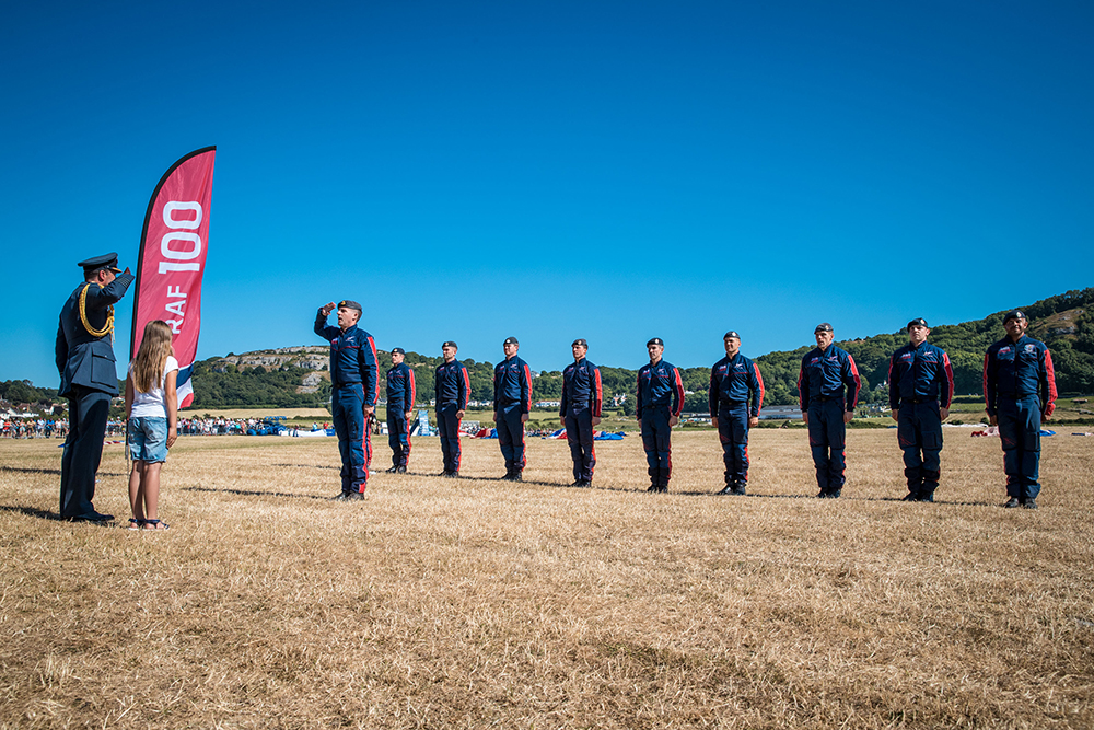 Flight Lieutenant David Sellers presents The RAF Falcons Parachute Display Team to Group Captain Nick Tucker-Lowe DSO MA MCMI RAF (RAF Valley Station Commander) along with Bonnie Gregory of Rhyl