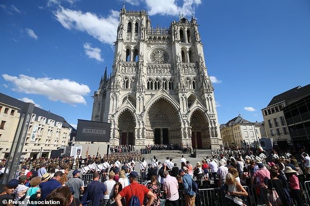 Crowds gather outside Amiens Cathedral.