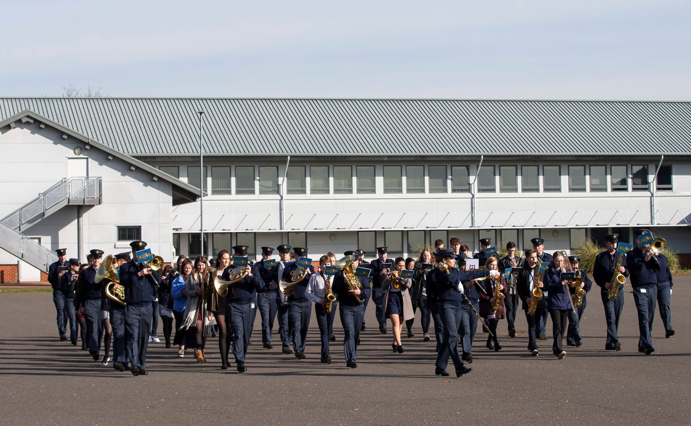 Royal Air Force Band teach students how to march.
