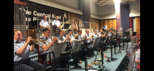The brass section of the Central Band of the RAF, playing music.