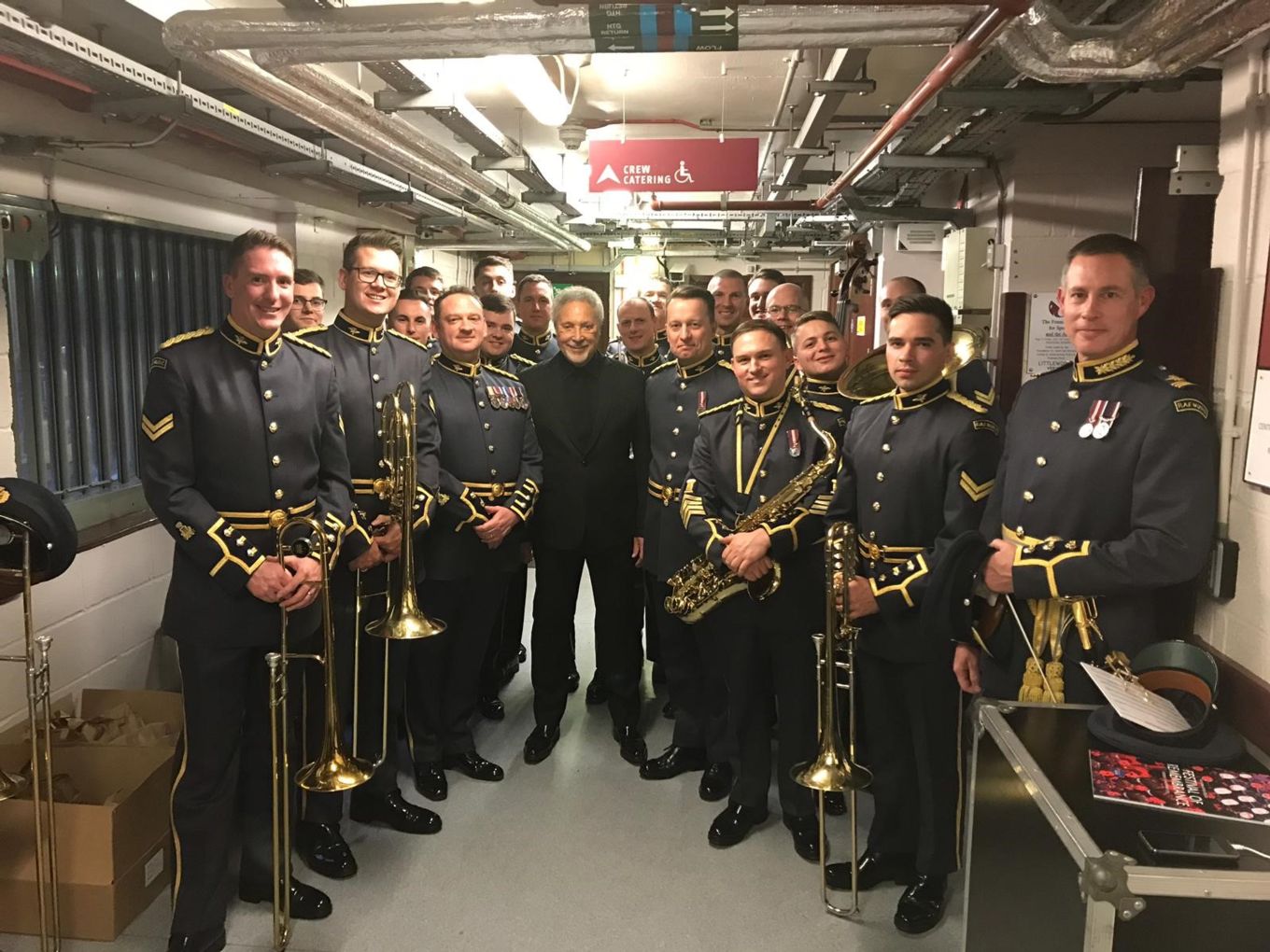 Sir Tom Jones pictured with the RAF Squadronaires backstage.