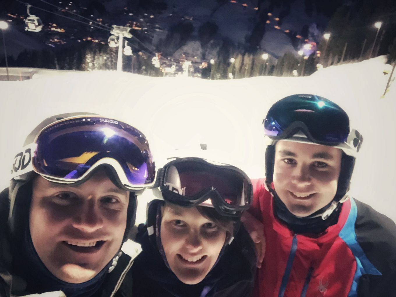 3 skiers smile for the camera.