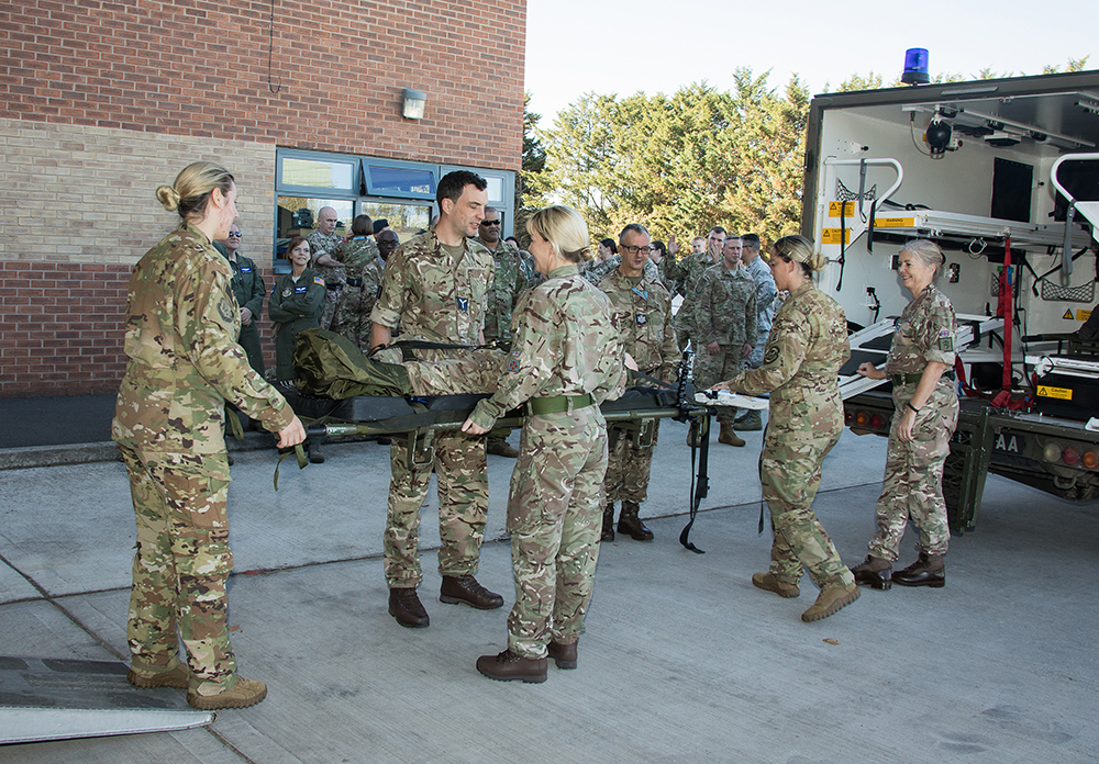 UK and US Medical Reservists demonstrate loading and unloading a patient from the Battlefield Ambulance