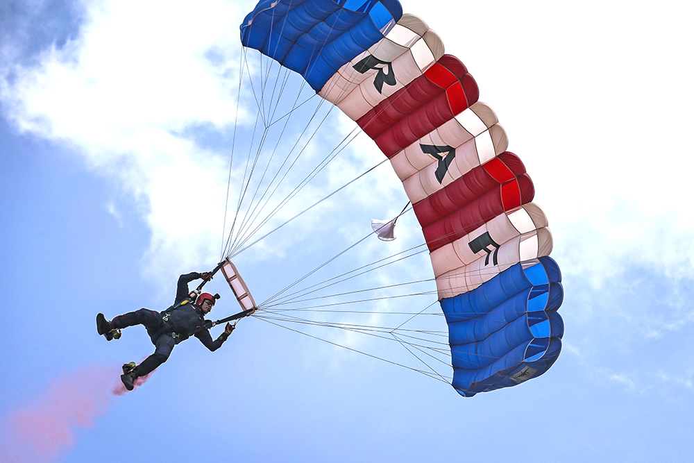 Pictured, a member of the RAF Falcons Parachute Display Team