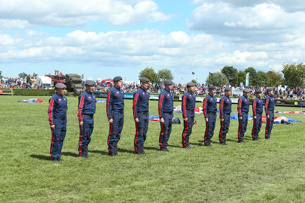 Members of the RAF Falcons Parachute Display Team in the main ring 