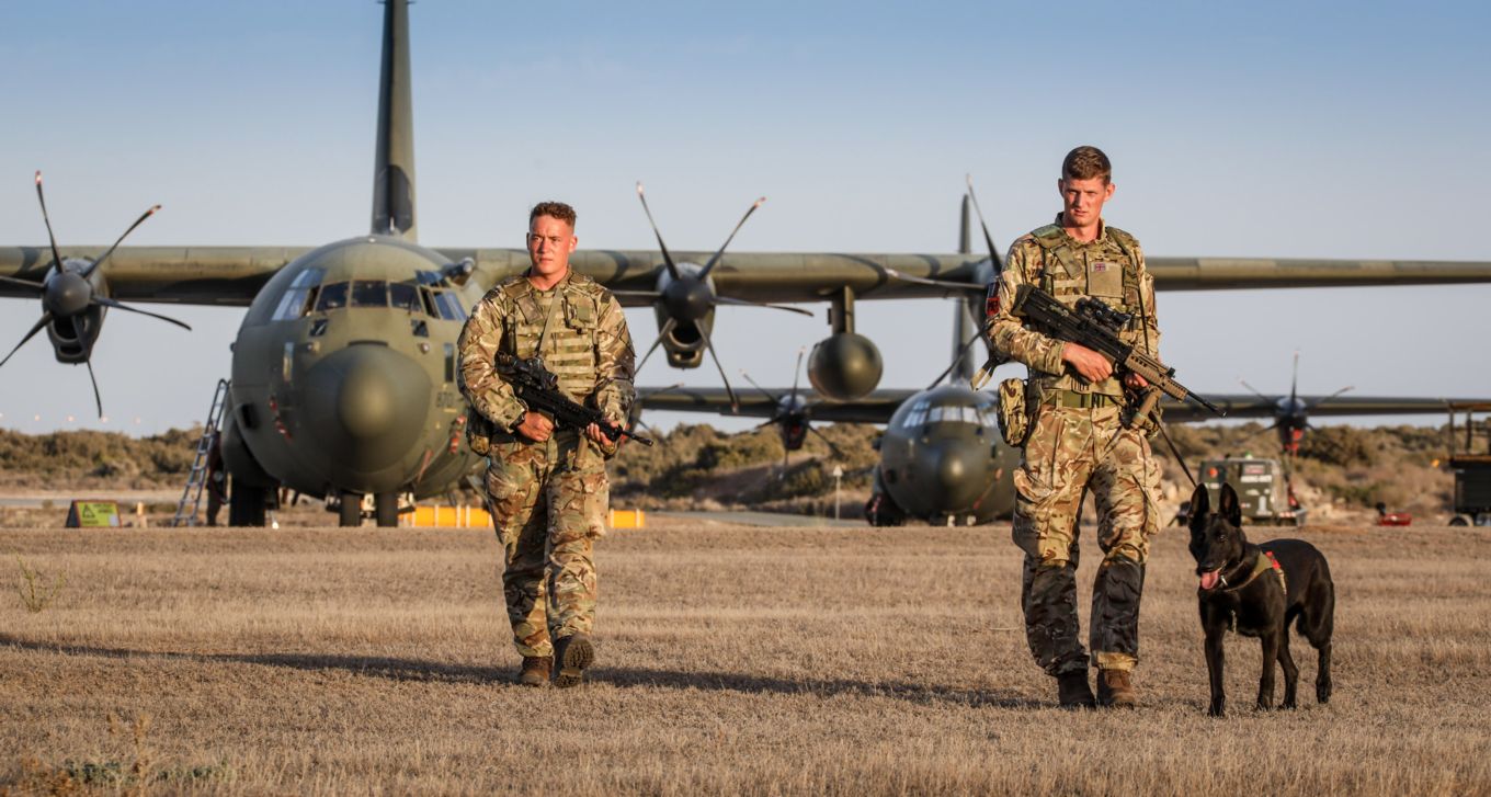 34 Sqn RAF Regiment routine patrol in front of Hercules C-130J aircraft RAF Akrotiri.