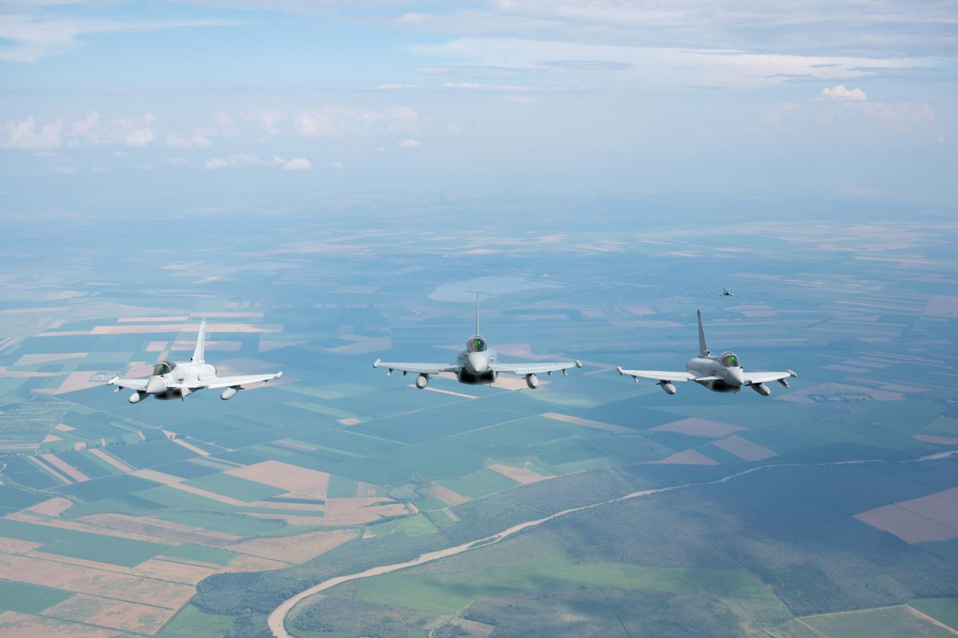 Image shows RAF and German Eurofighter Typhoons flying in formation.