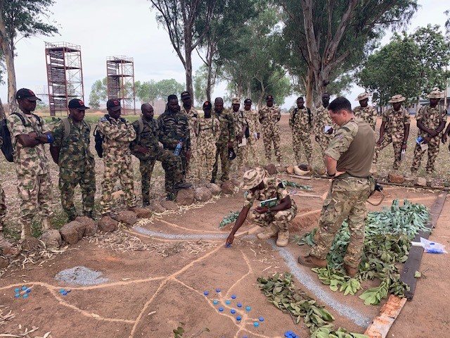 Image shows RAF personnel training Nigerian personnel.