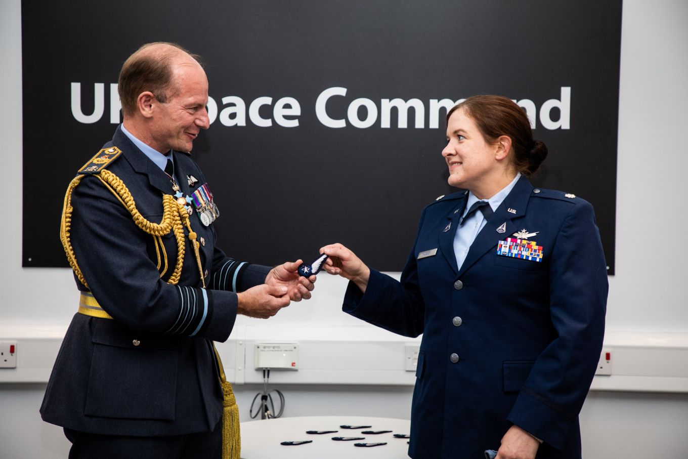 Chief of the Air Staff and personnel handling the 'Space Operator' badge.