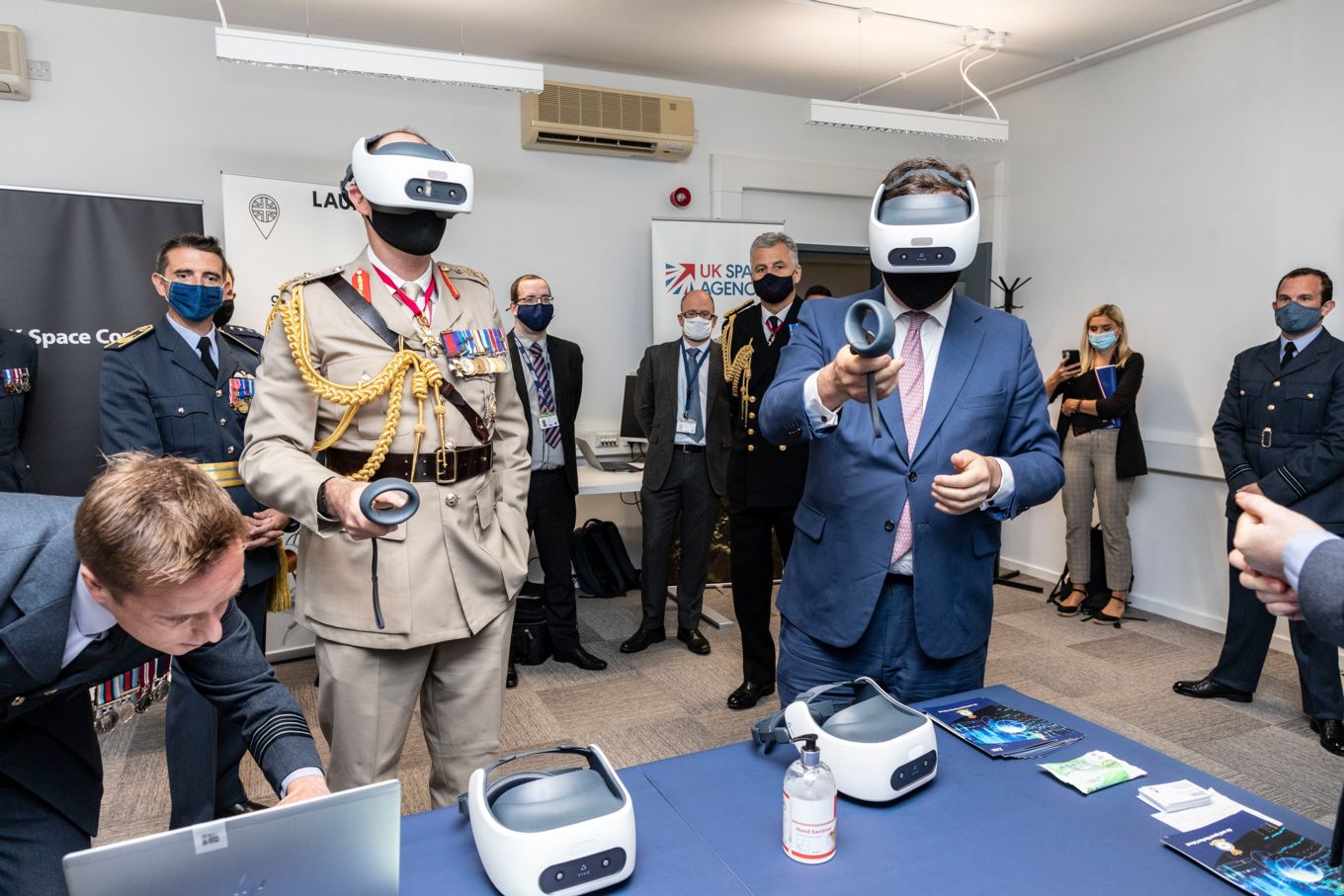 Attendants interact with Virtual Reality headsets and other gadgets.