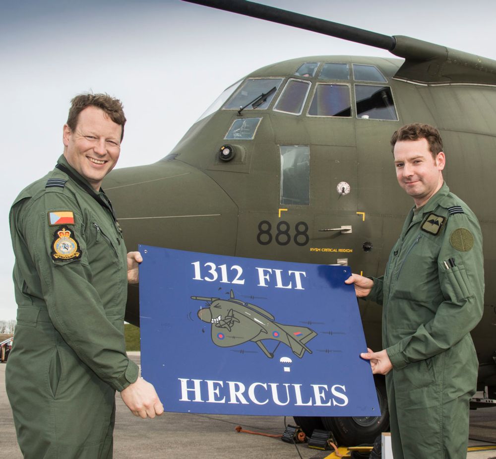 Officer Commanding No. 47 Squadron welcomes back 1312 Flight after the C-130 flight leaves Mount Pleasant