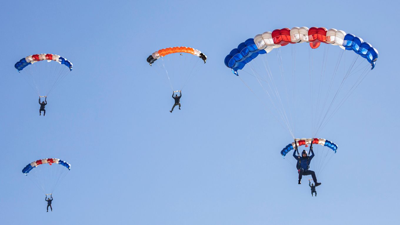 Three members of the RAF Falcons pictured perfectly on the Drop Zone in Lake Elsinore, California