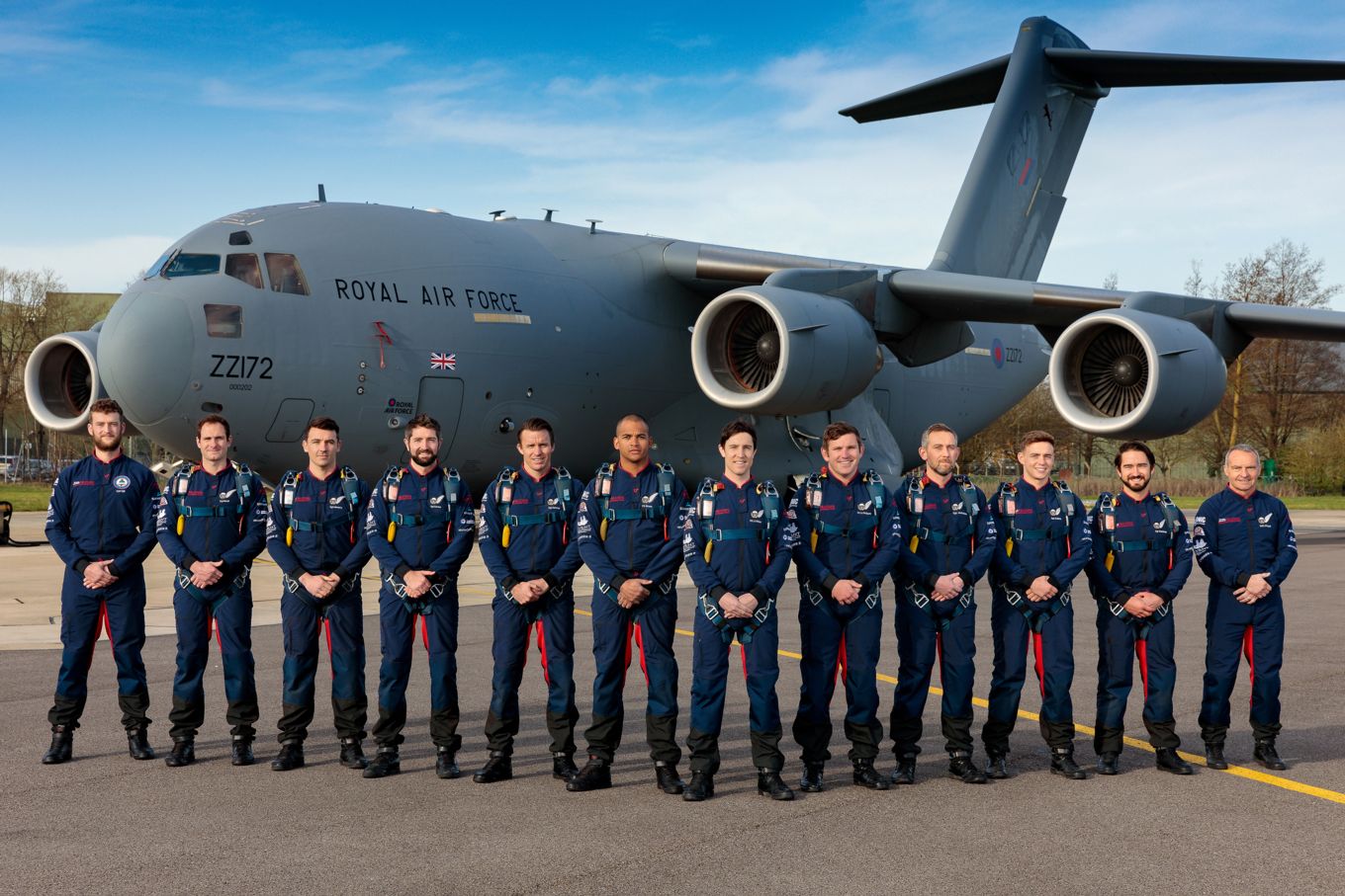 The 2021 RAF Falcons Parachute Display Team pictured at their home of RAF Brize Norton in front of a C-17 Globemaster