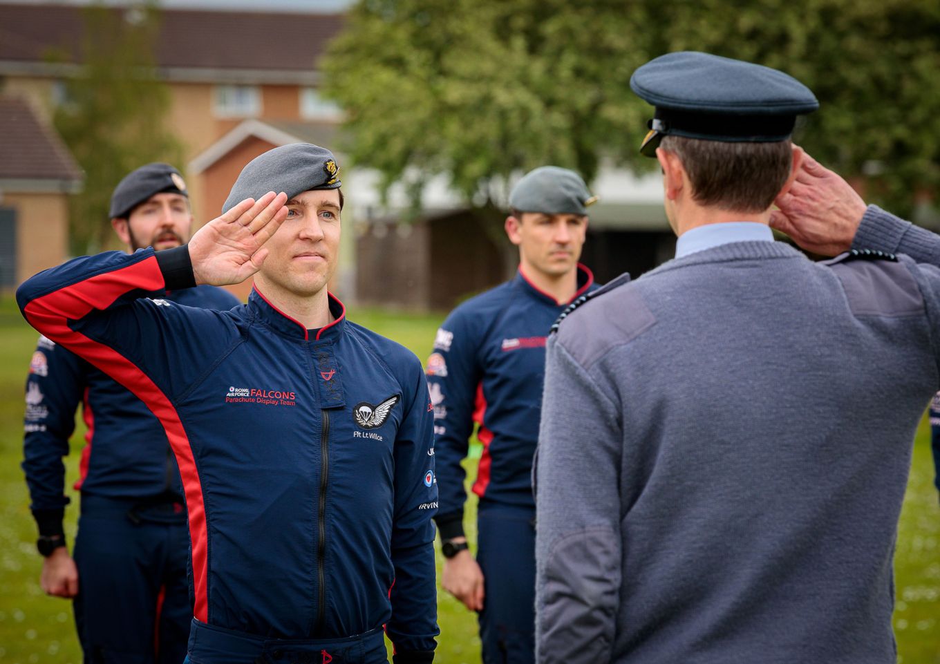 Group Captain Simon Blackwell, Commander Air Wing, receives the salute from Flight Lieutenant Chris Wilce, Officer Commanding RAF Falcons. 