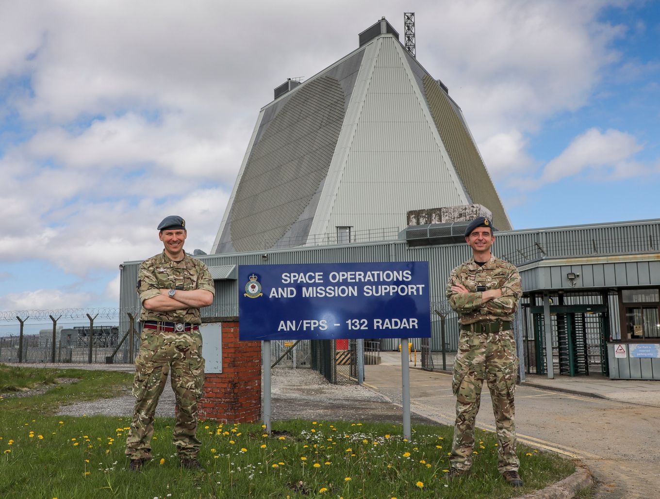 Air Vice-Marshal Godfrey and personnel stand outside RAF Fylingdales.
