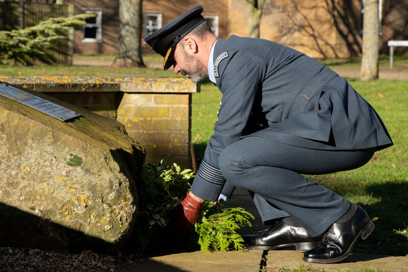 Gp Capt Holland pays his respects at the Stn Memorials 