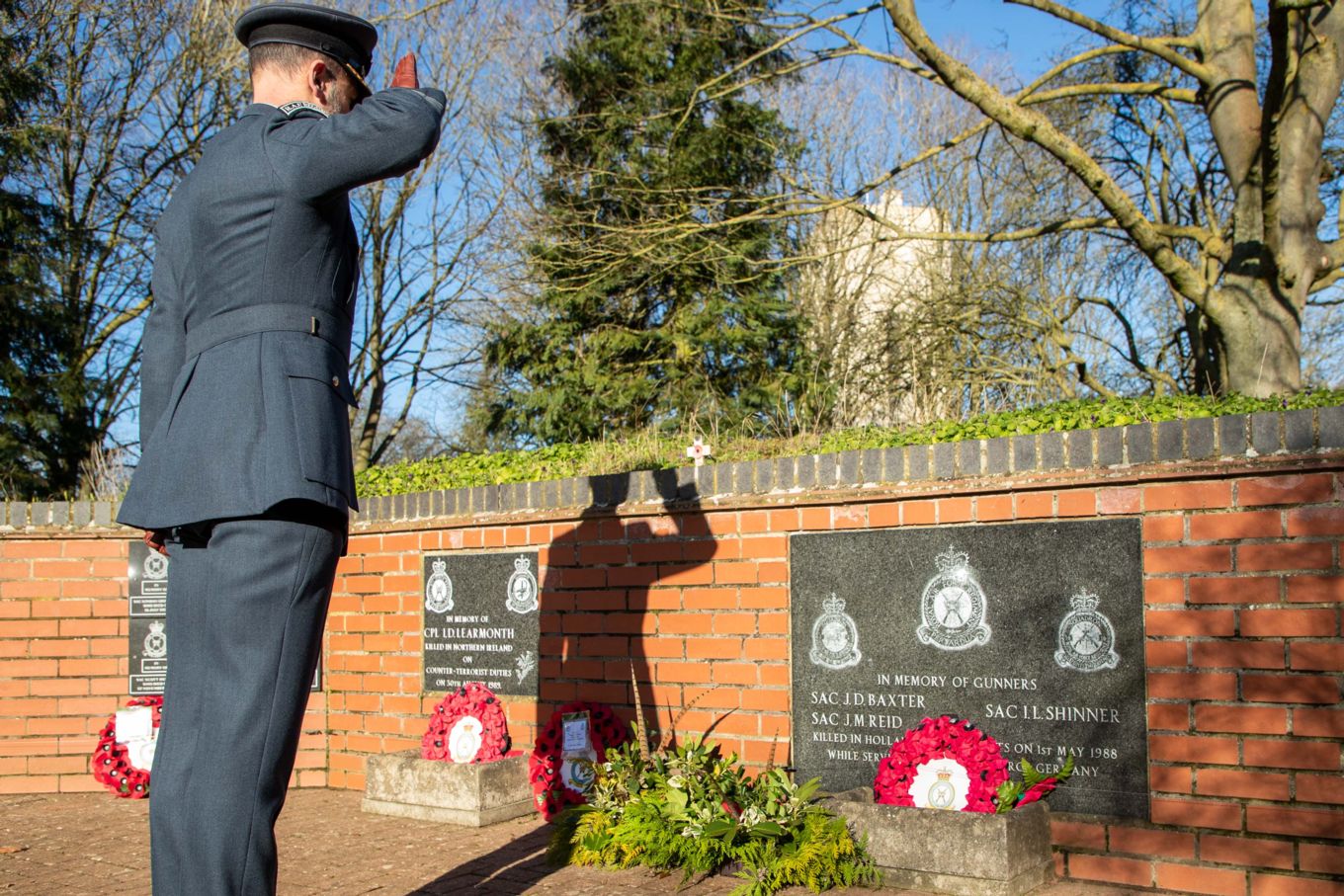 Gp Capt Holland pays his respects at the Stn Memorials 