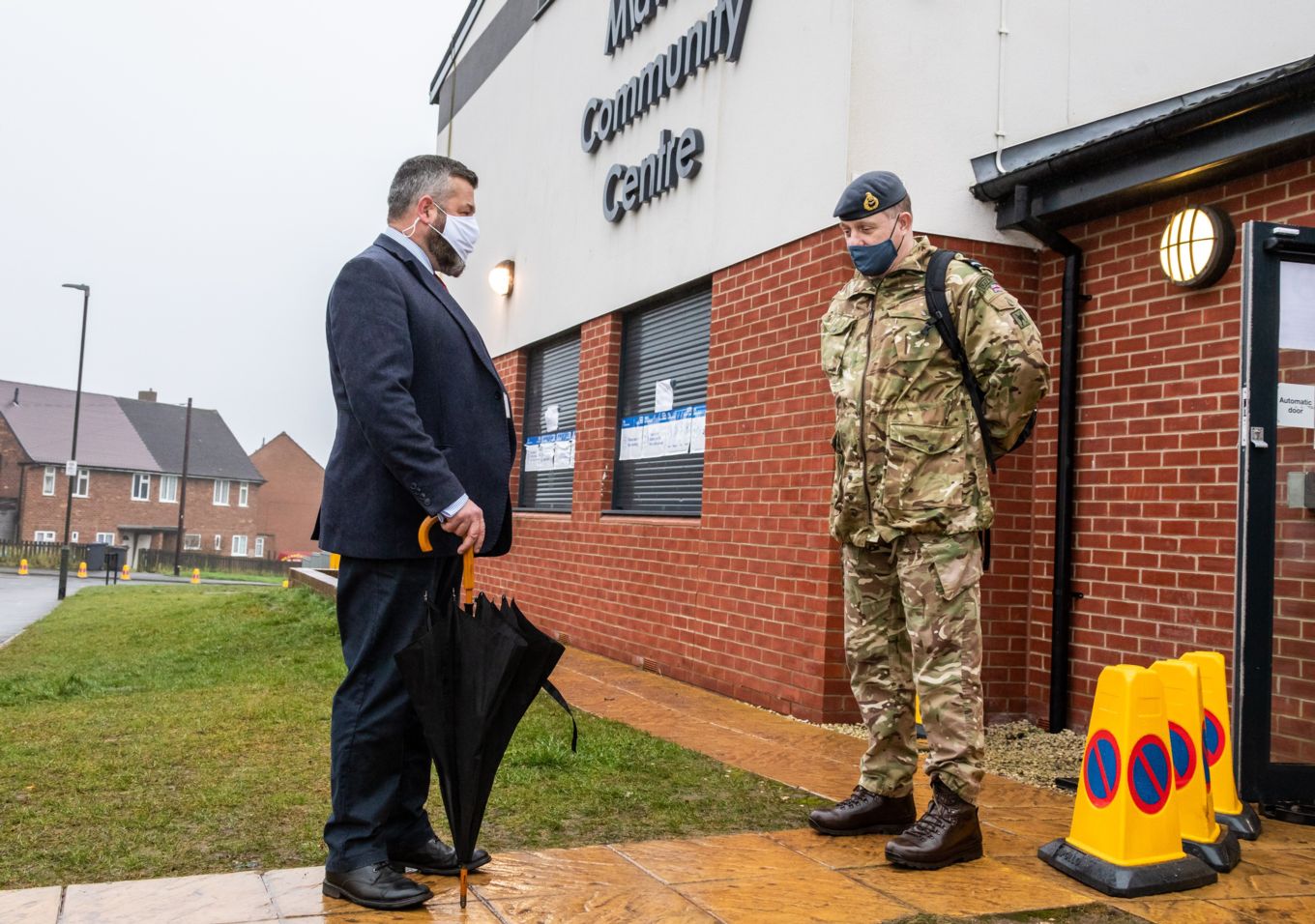 Air Commodore Miller meets a member of South Derbyshire Council outside Midway Community Centre in Swadlincote