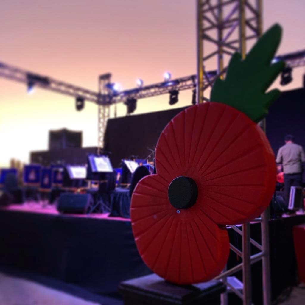 Large poppy adorns a set stage before a concert.