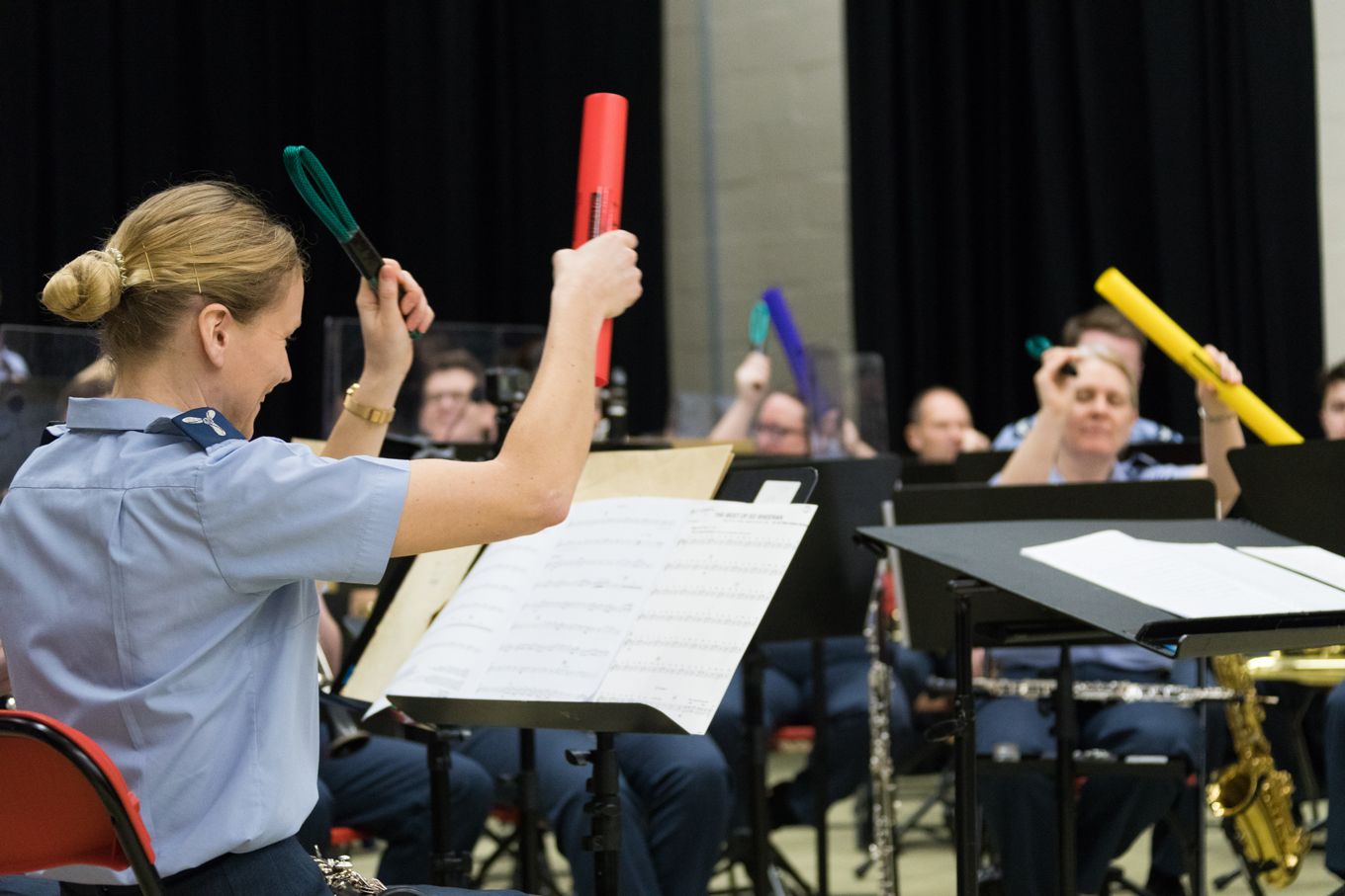 RAF musicians play boomwhackers.