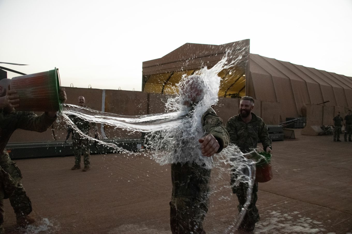 Master Aircrew Ruffles having a bucket of water thrown over him