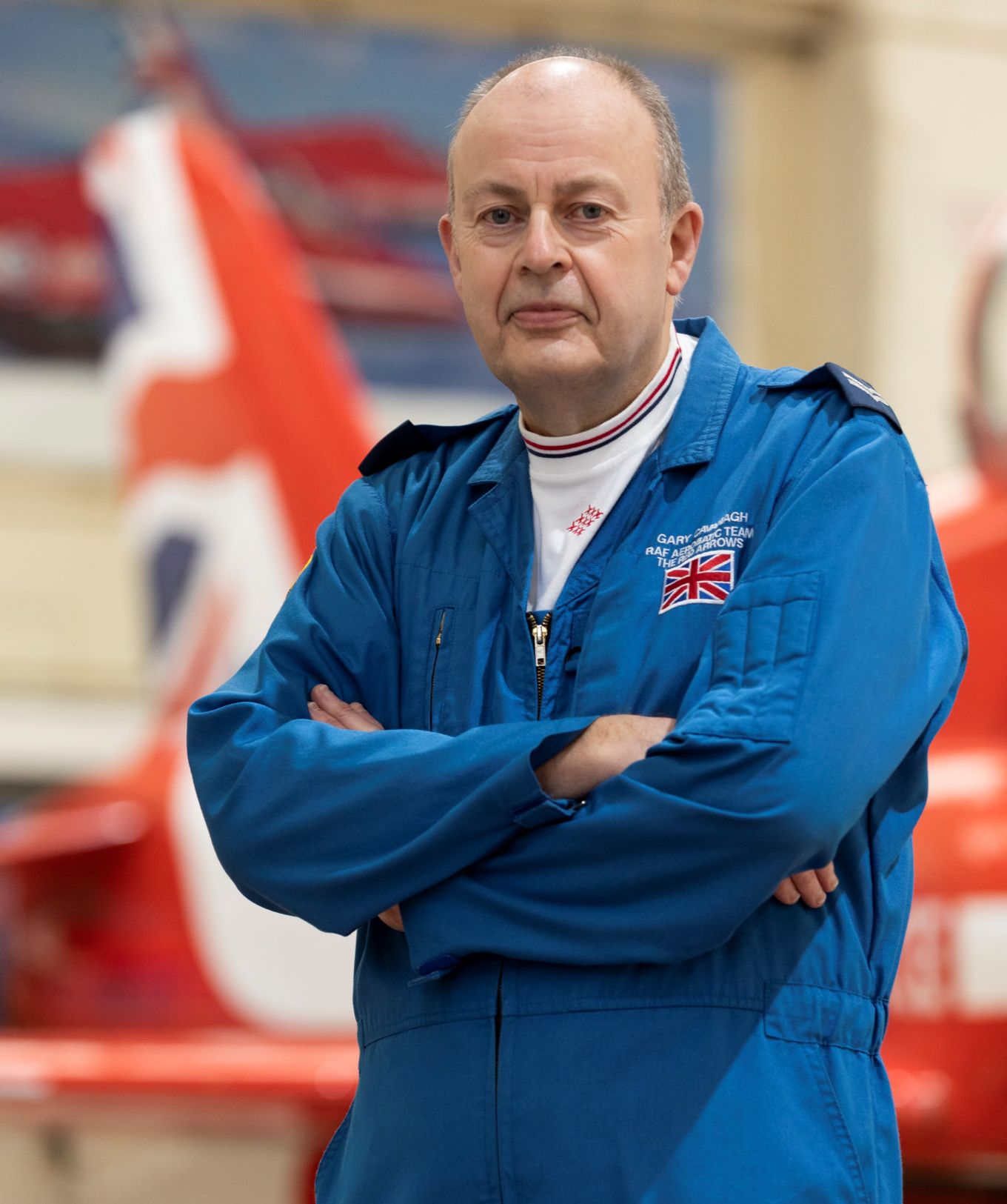 Corporal Gary Cavanagh stood next to Red Arrows jet.