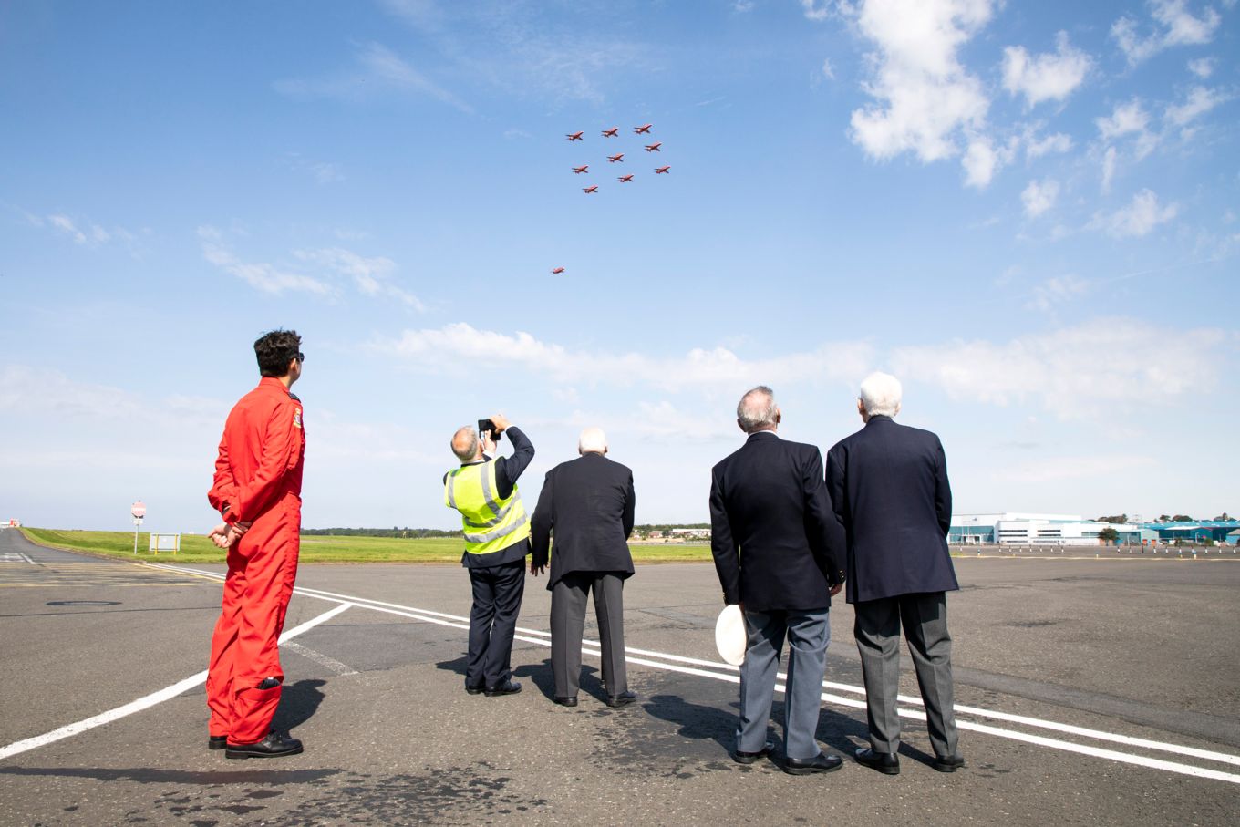 The veterans watch the Red Arrows land at Prestwick.